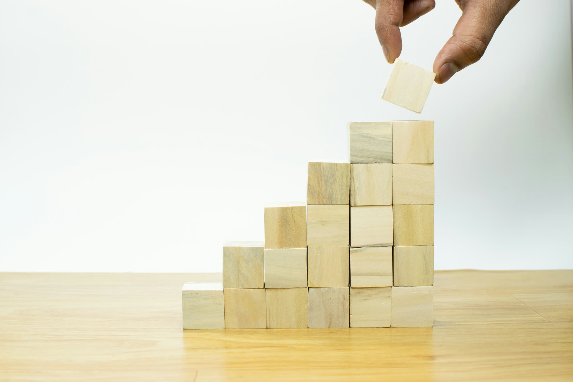 Wooden building blocks stacked into a structure